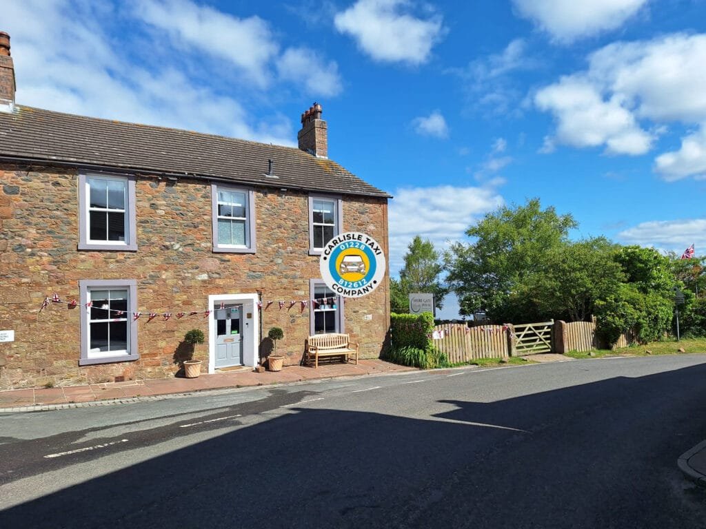 "Shore Gate House Bowness on Solway exterior view with Solway Firth backdrop and taxi parking area"
